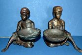 Pair of early 20th Century bronze figural coin bowls, Bergman style, c1920