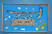 Framed collection of antique native American artefacts, c1890-1950